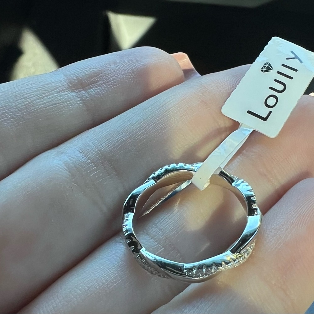 Real silver with diamonds twist wedding band.